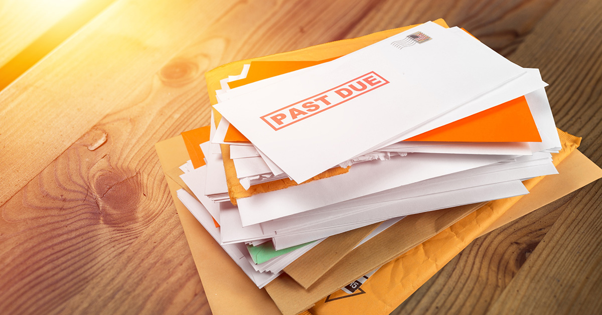 Image of bills with past due stamped on them