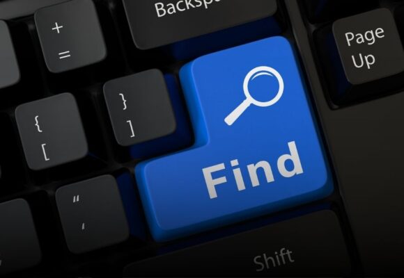 Image of a keyboard with a bright button that says "Find"
