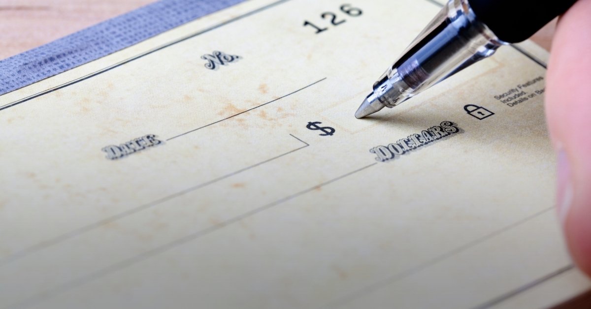Image of a paper check being written