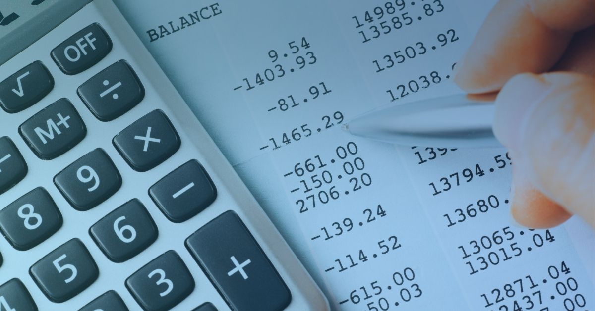 Image of a calculator and a bank balance tally