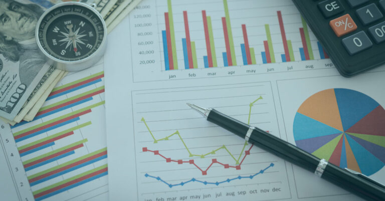 Image of financial dashboards on a desk