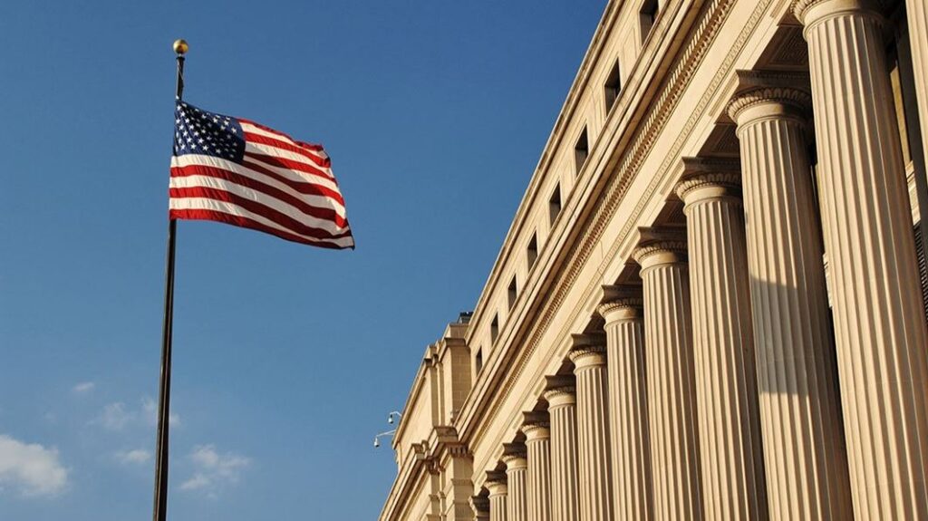 Image of a government building and US flag