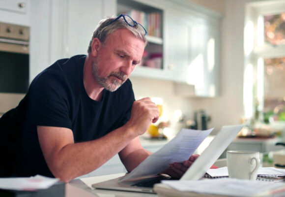 Image of a man looking over his retirement plan options