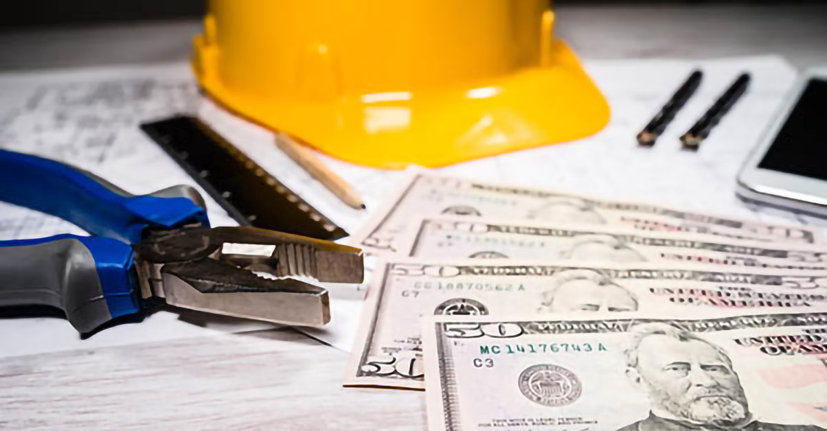 Image of a construction site with a stack of money