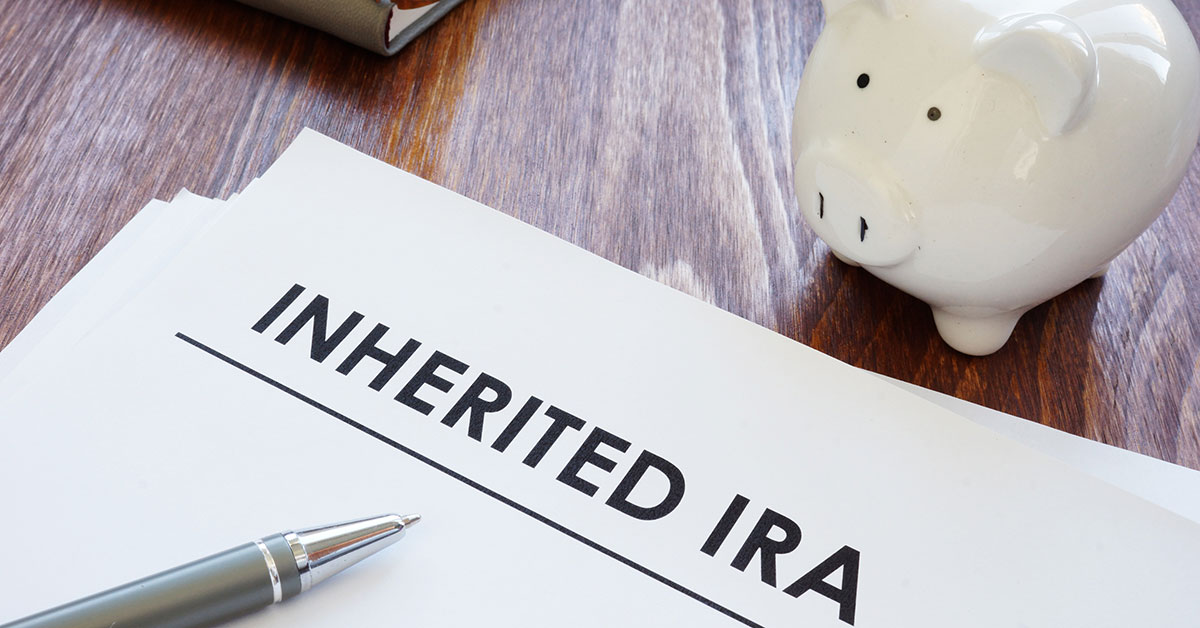 Image of a piggy bank and paper that says Inherited IRA
