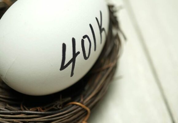 Image of a next with a white egg in it that says '401k'